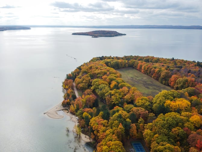Aerial fall foliage peninsula on Grand Traverse Bay